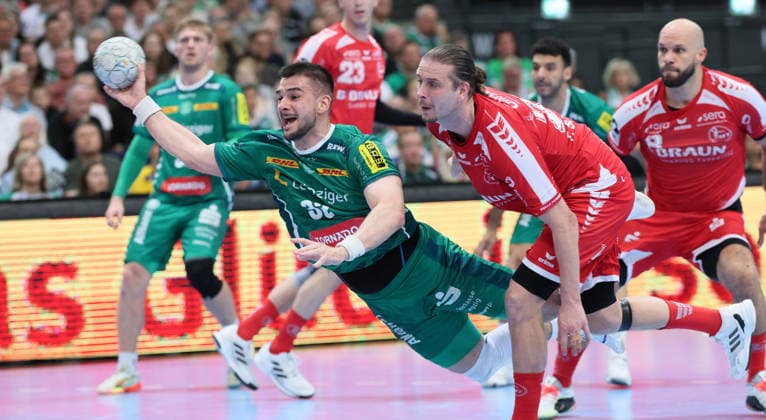 Leipzig, 21 05 2026, Arena Leipzig, Handball, Bundesliga, 32 Matchday , SC DHfK Leipzig vs MT Melsungen , In the picture from left Luka Rogan 33, Leipzig , Olle Forsell Schefvert 25, Melsungen , For editorial use only , DHB HBL regulations prohibit any use of photographs as image sequences and or quasi video ,