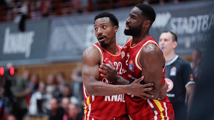In the picture from left Johnathan Stove Wuerzburg Baskets, 22 holds Eddy Edigin Wuerzburg Baskets, 27 back after a referee situation 22 05 2026, Basketball, Fitness First Wuerzburg Baskets vs Telekom Baskets Bonn, easyCredit BBL Playoffs, 3 Quarterfinals, Germany, 97072, tectake Arena Wuerzburg, Copyright: HMBxMedia xJulienxBecker
