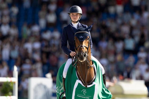 Lillie KEENAN USA on Kick On is happy about the victory, joy, laughter, at the award ceremony, Jumping S5 2nd Qualifier Rolex Grand Prix, Jumping competition with one round and jump-off, CSI5, Rolex Grand Slam, on 23 05 2026, World Equestrian Festival, TSCHIO Aachen 2026 from 22 24 05 2026 in Aachen Germany Â