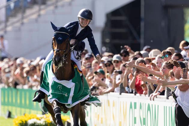Lillie KEENAN USA on Kick On is happy on the lap of honor, clapping with the fans, joy, laughter, cheering, after the award ceremony, Jumping S5 2nd Qualifier Rolex Grand Prix, Jumping competition with one round and jump-off, CSI5, Rolex Grand Slam, on 23 05 2026, World Equestrian Festival, TSCHIO Aachen 2026 from 22 24 05 2026 in Aachen Germany Â