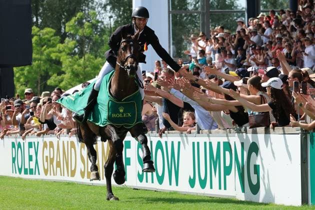 Winner, 1 place, Richard Vogel GER with horse United Touch S, Rolex Grand Slam of Show Jumping, prize-giving ceremony, lap of honor, high-five with the fans Jumping competition with two rounds and jump-off, World Equestrian Festival, World Equestrian Festival, TSCHIO Aachen 2026, TSCHIO instead of CHIO 2026, Aachener Soers, May 22 to 24, 2026, equestrian sport, May 24, 2026, Aachener Soers Germany