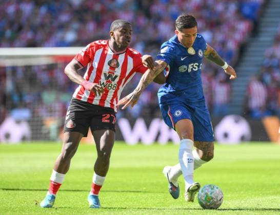 Enzo Fernandez of Chelsea fends off Noah Sadiki of Sunderland Sunderland v Chelsea, Premier League, Football, Stadium of Light, Sunderland, UK - 24 May 2026Sunderland Stadium of Light United Kingdom EDITORIAL USE ONLY No use with unauthorised audio, video, data, fixture lists, club league logos or live services. Online in-match use limited to 120 images, no video emulation. No use in betting, games or single club league player publications. Copyright: xRichardxLee Shutterstockx 16889858ad