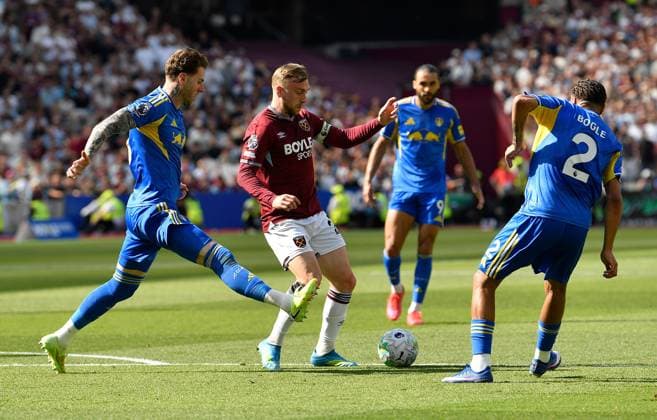 Jarrod Bowen of West Ham United in action with Joe Rodon Jayden Bogle of Leeds United West Ham United v Leeds United, Premier League, Football, London Stadium, London, UK - 24 May 2026London London Stadium United Kingdom EDITORIAL USE ONLY No use with unauthorised audio, video, data, fixture lists, club league logos or live services. Online in-match use limited to 120 images, no video emulation. No use in betting, games or single club league player publications. Copyright: xAlanxWalter Shutterstockx 16889881n