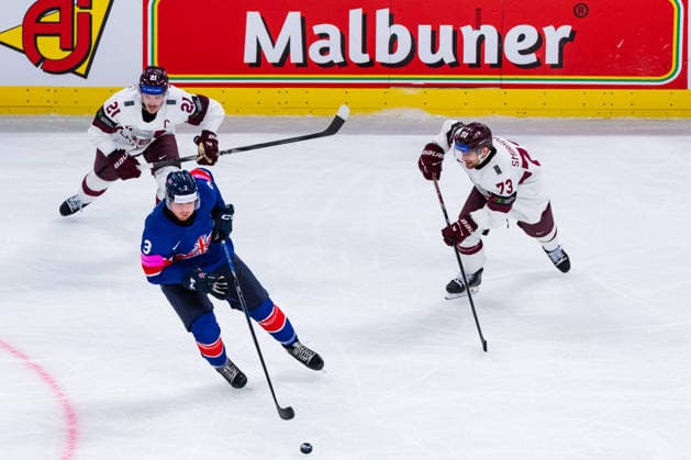 ZURICH, SWITZERLAND - MAY 24: Liam Steele (Great Britain, 3) gets away from Deniss Smirnovs (Latvia, 73) and Rudolfs Balcers (Latvia, 21) with the puck during the Preliminary Round - Group A Match 43 between Great Britain and Latvia at the IIHF Ice hockey, Eishockey World Championship, WM, Weltmeisterschaft 2026, Swiss Life Arena on May 24, 2026 in Zurich, Switzerland. Zurich Switzerland Copyright: xTimoxSteinx