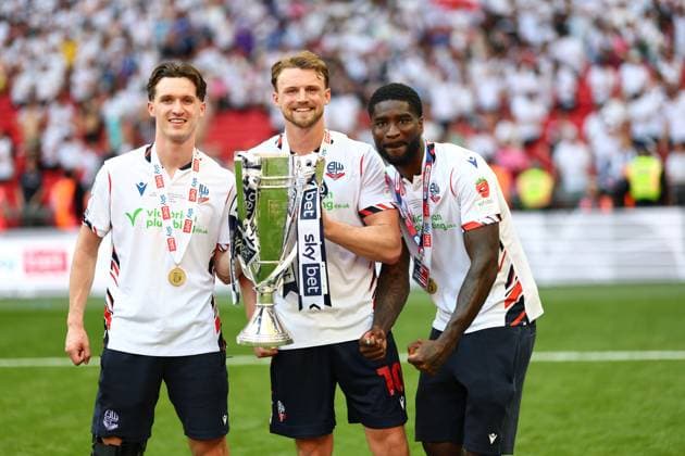 (Left to right) Johnny Kenny, Sam Dalby and Jordi Osei-Tutu of Bolton Wanderers celebrate after winning the Sky Bet EFL League One Play-off Final and promotion to the Sky Bet EFL Championship Bolton Wanderers v Stockport County, EFL Sky Bet League One, Play-Off Final, Football, Wembley Stadium, London, UK - 24 May 2026London Wembley Stadium United Kingdom EDITORIAL USE ONLY No use with unauthorised audio, video, data, fixture lists, club league logos or live services. Online in-match use limited to 120 images, no video emulation. No use in betting, games or single club league player publications. Copyright: xSimonxDael Shutterstockx 16889811lg