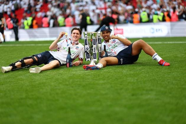 Johnny Kenny and Ethan Erhahon of Bolton Wanderers celebrate after winning the Sky Bet EFL League One Play-off Final and promotion to the Sky Bet EFL Championship Bolton Wanderers v Stockport County, EFL Sky Bet League One, Play-Off Final, Football, Wembley Stadium, London, UK - 24 May 2026London Wembley Stadium United Kingdom EDITORIAL USE ONLY No use with unauthorised audio, video, data, fixture lists, club league logos or live services. Online in-match use limited to 120 images, no video emulation. No use in betting, games or single club league player publications. Copyright: xSimonxDael Shutterstockx 16889811li