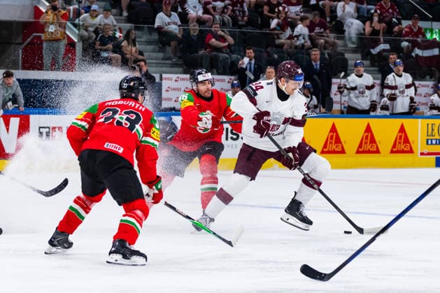 ZURICH, SWITZERLAND - MAY 26: Eduards Tralmarks (Latvia,34) in the battle for the puck with Balazs Seboek (Hungary, 86) and Milan Horvath (Hungary, 33) during the Preliminary Round - Group A Match 51 between Hungary and Latvia at the IIHF Ice hockey, Eishockey World Championship, WM, Weltmeisterschaft 2026, Swiss Life Arena on May 26, 2026 in Zurich, Switzerland. Zurich Switzerland Copyright: xTimoxSteinx