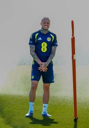 Lyndon Dykes of Scotland cools down under a sprinkler during a training session on a hot afternoon at Lesser Hampden. Scotland Team Training, Football, Hampden Park, Glasgow, Scotland, UK - 26 May 2026Glasgow Hampden Park United Kingdom EDITORIAL USE ONLY No use with unauthorised audio, video, data, fixture lists, club league logos or live services. Online in-match use limited to 120 images, no video emulation. No use in betting, games or single club league player publications. Copyright: xStuartxWallace Shutterstockx 16898315k