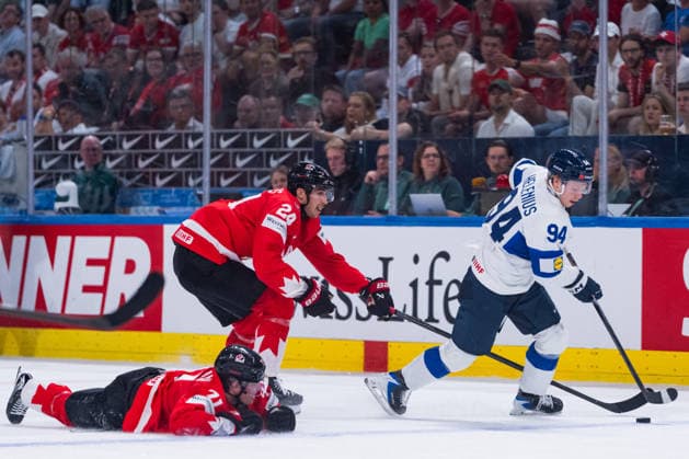 ZURICH, SWITZERLAND - MAY 30: Konsta Helenius (Finland, 94) in the battle for the puck with Dylan Cozens (Canada, 24) and the crashed Macklin Celebrini (Canada, 71) during the Half Finals - Match 62 between Canada and Finland at the IIHF Ice hockey, Eishockey World Championship, WM, Weltmeisterschaft 2026, Swiss Life Arena on May 30, 2026 in Zurich, Switzerland. Zurich Switzerland Copyright: xTimoxSteinx