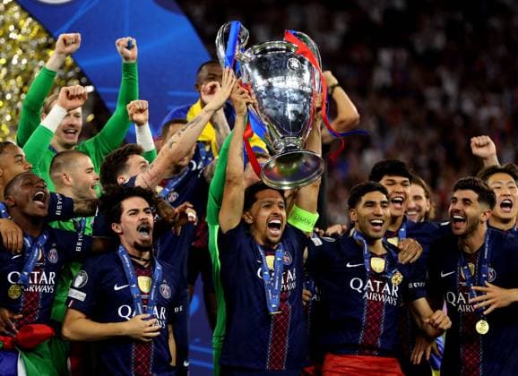 Vitinha of Paris Saint-Germain (centre) celebrate with the trophy winning the UEFA Champions League Paris Saint-Germain v Arsenal, UEFA Champions League, Final, Football, Puskas Arena, Budapest, Hungary - 30 May 2026Budapest Puskas Arena Hungary EDITORIAL USE ONLY No use with unauthorised audio, video, data, fixture lists, club league logos or live services. Online in-match use limited to 120 images, no video emulation. No use in betting, games or single club league player publications. Copyright: xKieranxMcManus Shutterstockx 16898280dl