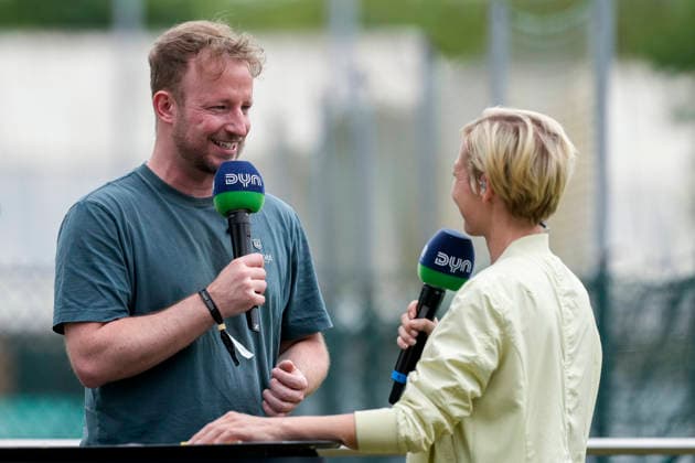 from left Andre Henning national coach men, HONAMAS , Anett Sattler presenter, DYN , with microphone during interview, TV, television, joy, happy, pleased, friendly, cheerful, happy, beaming, optimistic, 31 05 2026, Bonn Germany , Hockey, German Championship, Final, Men, Hamburger Polo Club HTC Uhlenhorst Mülheim xozx