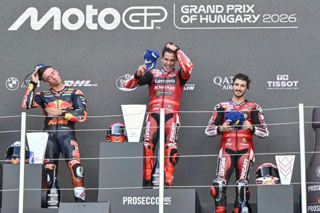 MOTO - MOTO GP - HUNGARY GRAND PRIX 2026 Podium MARQUEZ Marc (spa), Ducati Lenovo Team, Ducati Desmosedici GP26, portrait ACOSTA Pedro (spa), Red Bull KTM Factory Racing, KTM RC16, portraitBAGNAIA Francesco (ita), Ducati Lenovo Team, Ducati Desmosedici GP26, portrait celebrates his third place on podium during the 2026 MotoGP Grand Prix of Hungary , on Balaton Park circuit, from June 5 to 7, in Hungary - Balaton ParkHungary Copyright: xGIGIxSOLDANOx
