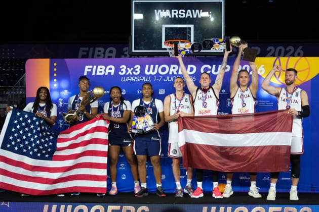 June 7, 2026, Warsaw, Masovian Voivodeship, Poland: USA s MILAYSIA FULWILEY (4), MIKAYLAH WILLIAMS (12), SAHARA WILLIAMS (6), and JOYCE EDWARDS (13) celebrate with their women s 1st place medals and the world champions trophy; Latvia s FRANCIS LACIS (6), NAURIS MIEZIS (1), KARLIS LASMANIS (2), and ZIGMARS RAIMO (9) celebrate with their men s 1st place medals and men s world champions trophy during the prize ceremony at the conclusion of the 2026 FIBA 3x3 Basketball World Cup in Warsaw, Poland. Basketball 2026: FIBA 3x3 World Cup Prize Ceremony - ZUMAk204 20260607_zip_k204_103 Copyright: xRomanxKozielx