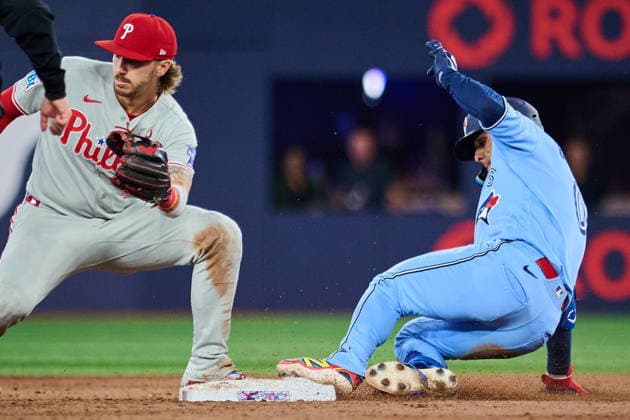 June 8, 2026, Toronto, On, Canada: Philadelphia Phillies second baseman Bryson Stott (5) looks for the throw as Toronto Blue Jays Andres Gimenez (0) slides in safe to second on a double during ninth inning MLB, Baseball Herren, USA baseball action in Toronto, on Monday, June 8, 2026. Canada News - June 8, 2026 - ZUMAc35_ 20260608_zaf_c35_259 Copyright: xSammyxKoganx