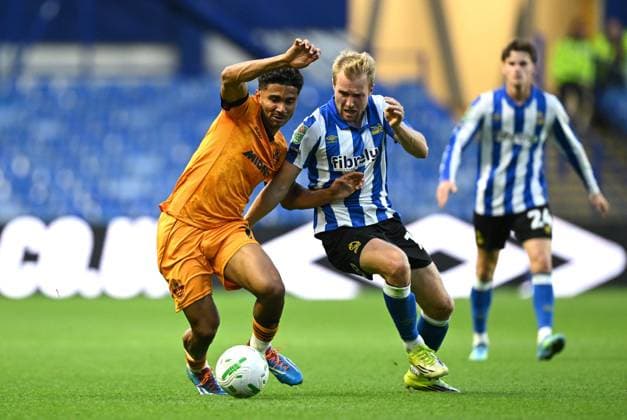 Pedro Lima of Wolverhampton Wanderers and Billy Mitchell of Sheffield Wednesday Sheffield Wednesday v Wolverhampton Wanderers, EFL Carabao Cup, Second Round, Football, Hillsborough, Sheffield, UK - 25 Aug 2026Sheffield Hillsborough United Kingdom EDITORIAL USE ONLY No use with unauthorised audio, video, data, fixture lists, club league logos or live services. Online in-match use limited to 120 images, no video emulation. No use in betting, games or single club league player publications. Copyright: xGreigxCowie Shutterstockx 17114999ag