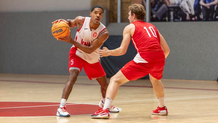 Pictured from left: Kenny Dye of the Würzburg Baskets, No. 5, with the ball against Calvin Wishart of the Würzburg Baskets, No. 10, on August 27, 2026, during media training for the Fitness First Würzburg Baskets 2026–27, Germany, Würzburg, Training Center, Copyright: HMBxMedia xJulienxBecker