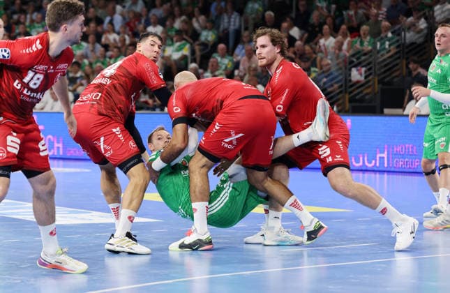 Daniel Dujshebaev, Adrian Sipos, and Johannes Golla hold Mathias Gidsel in a tackle. Match scene, action, sports, handball, HBL Bundesliga, Men s Division 1, Matchday, 2026–2027 season, August 27, 2026, Füchse Berlin vs. MT Melsungen