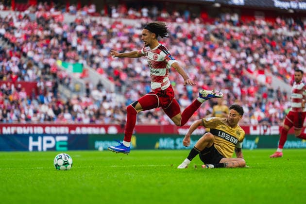Anas Slimani of Fortuna Düsseldorf, No. 34, jumps over a tackle by Nicolas Sessa of VFB Stuttgart II, No. 10; Fortuna Düsseldorf vs. VFB Stuttgart II, soccer, 3. Liga, Matchday 03, 2026–27 season, August 28, 2026, DFL regulations prohibit any use of photographs as image sequences and or quasi-video. Fortuna Düsseldorf vs. VFB Stuttgart II, soccer, 3. Liga, Matchday 3, 2026–27 season, August 28, 2026, Düsseldorf Copyright: xEibner-Pressefoto LukasxBaldygax EP_LBA