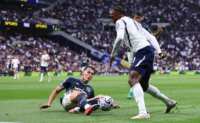 Amar Dedic of Newcastle United wins the ball from Mathys Tel of Tottenham Hotspur Tottenham Hotspur v Newcastle United, Premier League Football, Football, Tottenham Hotspur Stadium, London, UK - 29 Aug 2026London Tottenham Hotspur Stadium United Kingdom EDITORIAL USE ONLY No use with unauthorised audio, video, data, fixture lists, club league logos or live services. Online in-match use limited to 120 images, no video emulation. No use in betting, games or single club league player publications. Copyright: xMichaelxZemanek Shutterstockx 17119028aj