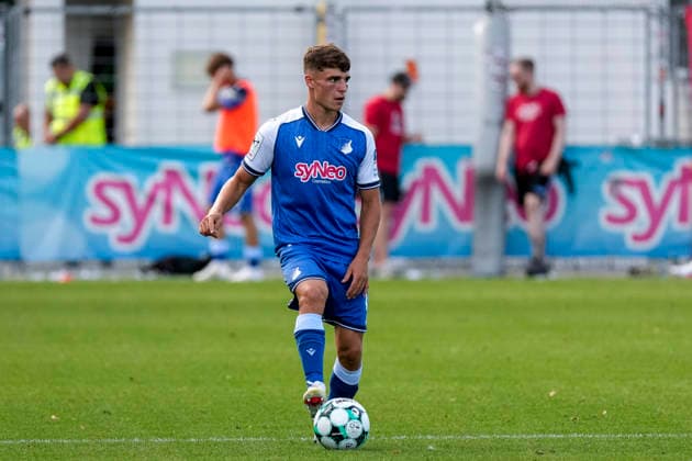 Matthew Moore TSG II, 15, on the ball, isolated figure, full-body shot, single frame, single photo, action, 29 Aug 2026, Sinsheim, Germany, soccer, 3rd Division, TSG 1899 Hoffenheim II vs. SSV Jahn Regensburg, DFB and DFL regulations prohibit any use of photographs as image sequences and or quasi-video xozx