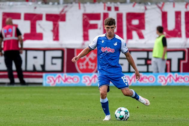 Matthew Moore TSG II, 15, on the ball, cutout, full-body, single frame, single photo, action, 08 29 2026, Sinsheim, Germany, soccer, 3. Liga, TSG 1899 Hoffenheim II vs. SSV Jahn Regensburg, DFB and DFL regulations prohibit any use of photographs as image sequences and or quasi-video xozx