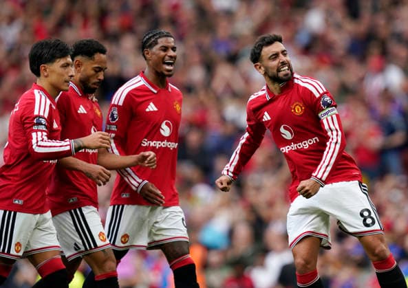 Manchester, England, 30th August 2026. Bruno Fernandes of Manchester United, ManU celebrates scoring the third from the penalty spot during the Manchester United vs Ipswich Town Premier League match at Old Trafford, Manchester. Picture credit should read: Andrew Yates Sportimage EDITORIAL USE ONLY. No use with unauthorised audio, video, data, fixture lists, club league logos or live services. Online in-match use limited to 120 images, no video emulation. No use in betting, games or single club league player publications. SPI_066_AY_Man_Utd_Ipswich SPI-4945-0066