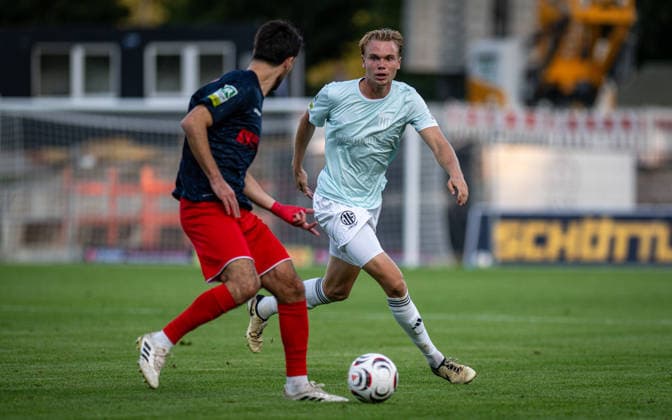 Soccer, 2026–2027 Season, Regionalliga West, September 1, 2026, Matchday 6, Men’s, 1 FC Bocholt (mint) vs. Bonner SC (blue and red), Cagatay (Bonner SC squad), Kilian Zaruba (1 FC Bocholt), Bocholt Stadion am Huenting, Germany 260901_fb_1fc-bocholt_bonner-sc_58357