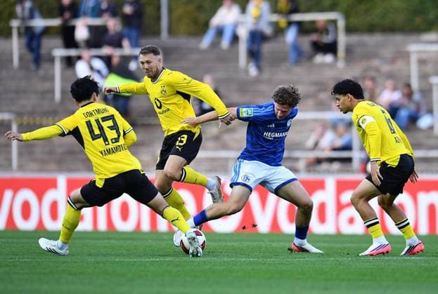 Borussia Dortmund U23 vs. Schalke 04 U23 ** FOR EDITORIAL USE ONLY ** EDITORIAL USE ONLY ** p Soccer Regionalliga West, Matchday 6: Borussia Dortmund U23 vs. Schalke 04 U23 on September 1, 2026, at the Rote Erde Stadium in Dortmund. From left to right: Takata Yamamoto (Borussia Dortmund U23), Connor Krempicki, Borussia Dortmund U23; Jonas Zgorecki, Schalke 04 U23; Ayman Azhil, Borussia Dortmund U23; Germany, North Rhine-Westphalia, Dortmund; Copyright ThorstenxTillmann Copyright: ThorstenxTillmann doc87ezw2hm6o61cbqfal3h ,EDITORIAL USE ONLY Copyright: ThorstenxTillmann