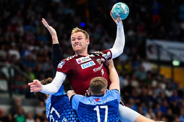 TVB Stuttgart vs. Füchse Berlin, Handball 1 Bundesliga, Men s, 2026–2027 Season, TVB Stuttgart vs. Füchse Berlin, Porsche Arena, Berlin s Mathias Gidsel (M) in action against Stuttgart s Philipp Meyer (L) and Stuttgart s Samuel Röthlisberger (R), Stuttgart, Porsche Arena, Baden-Württemberg, Germany