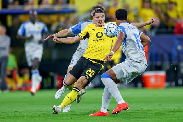 September 8, 2026, Soccer, UEFA Champions League, Borussia Dortmund vs. Villarreal CF, Champions League Matchday 1, Signal Iduna Park, 2026–27 Season: Marcel Sabitzer (BVB, No. 20) in a tackle against Santiago Mourino (Villarreal CF, No. 15). DFB regulations prohibit any use of photographs as image sequences and or quasi-video. North Rhine-Westphalia, Germany