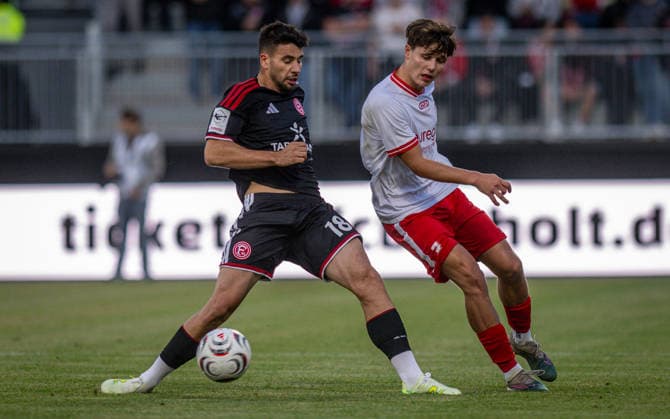 Soccer, 2026–2027 Season, Lower Rhine Cup, September 9, 2026, First Round, Men’s, SV Biemenhorst White vs. Fortuna Düsseldorf Black; left: Miguel Fernandes Goncalves (Fortuna Düsseldorf), Ferdinand Schulte (SV Biemenhorst); Bocholt, Stadion am Huenting, Germany 260909_fb_sv-biemenhorst_fortuna-duesseldorf_58632