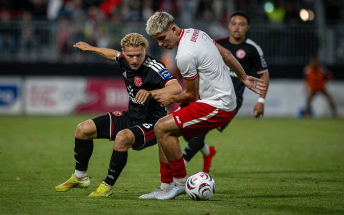 Soccer, 2026–2027 Season, Lower Rhine Cup, September 9, 2026, First Round, Men’s, SV Biemenhorst White vs. Fortuna Düsseldorf Black; from left: Andreas Mueller (Fortuna Düsseldorf), Max Peerenboom (SV Biemenhorst), Bocholt, Stadion am Huenting, Germany 260909_fb_sv-biemenhorst_fortuna-duesseldorf_58681