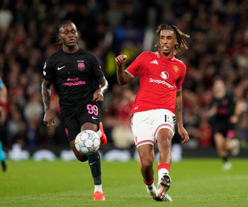 Manchester, England, 10th September 2026. Orphe Mbina of Sabah FC and Leny Yoro of Manchester United, ManU during the Manchester United vs Sabah UEFA Champions League match at Old Trafford, Manchester. Picture credit should read: Andrew Yates Sportimage EDITORIAL USE ONLY. No use with unauthorised audio, video, data, fixture lists, club league logos or live services. Online in-match use limited to 120 images, no video emulation. No use in betting, games or single club league player publications. SPI_052_AY_Man_Utd_Sabah SPI-4989-0054