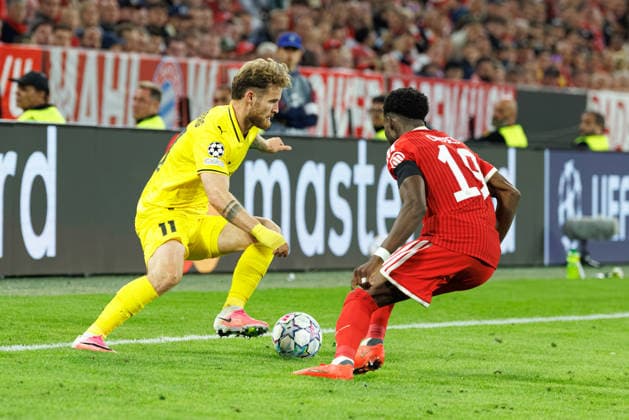 Ole Didrik Blomberg, 11, FK Bodo Glimt, and Alphonso Davies, 19, FC Bayern Munich, during the match between FC Bayern Munich and FK Bodo Glimt, soccer, men s, UEFA Champions League, 2026–2027, Matchday 1 on September 10, 2026, in Munich, Allianz Arena, Bavaria, Germany