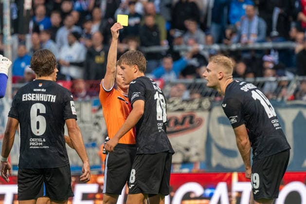 Tim Kloss of Viktoria Cologne, No. 18, receives a yellow card from referee Sebastian Hilsberg during the match between FC Viktoria Cologne and FC Hansa Rostock, soccer, 3. Liga, Matchday 5, 2026–2027 season, September 11, 2026 DFL DFB regulations prohibit any use of photographs as image sequences and or quasi-video FC Viktoria Cologne vs. FC Hansa Rostock, soccer, 3. Liga, Matchday 5, 2026–2027 season, September 11, 2026, Cologne Copyright: xEibner-Pressefoto ThomasxHaeslerx EP_THR