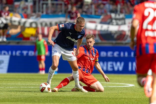 Fierce tackle: Patrick Mainka (1 FC Heidenheim, 06) slides in on Phil Harre (Holstein Kiel, 19), GER, 1 FC Heidenheim vs. Holstein Kiel, Soccer, 2. Bundesliga, Matchday 5, 2026–2027 season, September 13, 2026, DFL and DFB regulations prohibit any use of photographs as image sequences and or quasi-video, GER, 1 FC Heidenheim vs. Holstein Kiel, Soccer, 2. Bundesliga, Matchday 5, 2026–2027 Season, September 13, 2026, Heidenheim Copyright: xEibner-Pressefoto JanixPlessx EP_JPL