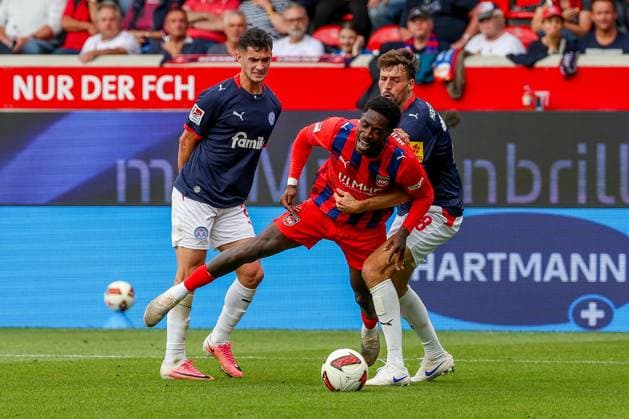 Guillermo Balzi (8, Holstein Kiel) and Jonas Meffert (28, Holstein Kiel) in action against Christian Conteh (10, 1. FC Heidenheim 1846), 1. FC Heidenheim 1846 vs. Holstein Kiel, Soccer, DFL, 2. Bundesliga, 2026–2027 season, first half of the season, Matchday 5, September 13, 2026, Heidenheim, Baden-Württemberg, Germany Copyright: xkolbert-press MartinxAgüerax