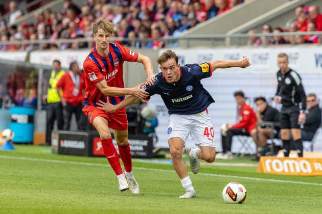 Fierce tackle by Jan Schoeppner of 1 FC Heidenheim (03) on Leon Parduzi of Holstein Kiel (40) to the shoulder and arm, GER, 1 FC Heidenheim vs. Holstein Kiel, Soccer, 2. Bundesliga, Matchday 5, 2026–2027 season, September 13, 2026, DFL and DFB regulations prohibit any use of photographs as image sequences and or quasi-video, GER, 1 FC Heidenheim vs. Holstein Kiel, Soccer, 2. Bundesliga, Matchday 5, 2026–2027 Season, September 13, 2026, Heidenheim Copyright: xEibner-Pressefoto JanixPlessx EP_JPL