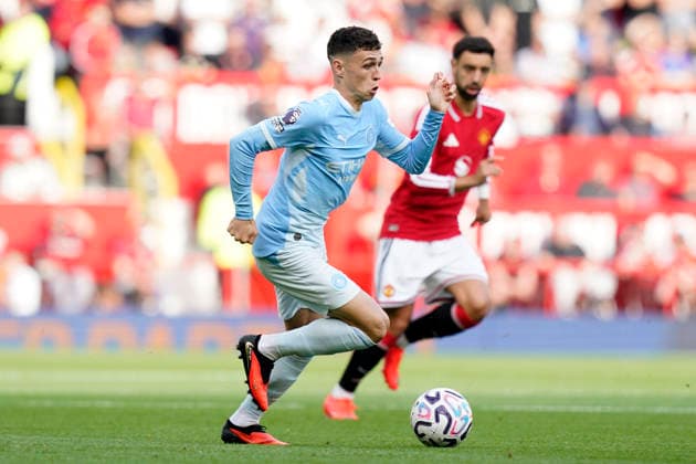 Manchester, England, 13th September 2026. Phil Foden of Manchester City during the Manchester United, ManU vs Manchester City Premier League match at Old Trafford, Manchester. Picture credit should read: Andrew Yates Sportimage EDITORIAL USE ONLY. No use with unauthorised audio, video, data, fixture lists, club league logos or live services. Online in-match use limited to 120 images, no video emulation. No use in betting, games or single club league player publications. SPI_021_AY_MAN_UTD_MAN_CITY SPI-4993-0022