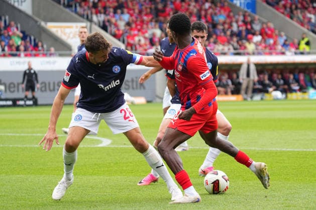 2nd Division, Matchday 5, 2026–27 Season, FC Heidenheim vs. Holstein Kiel; Christian Conteh; FC Heidenheim is put under pressure by Jonas Meffert and Guillermo Balzi of Holstein Kiel; Heidenheim calls for a penalty; FC Heidenheim vs. Holstein Kiel; 2. Bundesliga, Matchday 5, 2026–27 season, FC Heidenheim vs. Holstein Kiel, Germany, Heidenheim, Voith Arena, September 13, 2026 SP_GHR