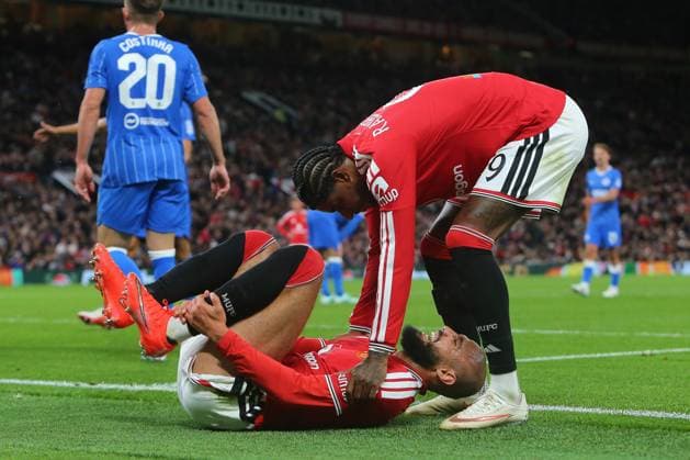 Marcus Rashford of Manchester United, ManU attends to an injured Noussair Mazraoui of Manchester United Manchester United v Brighton & Hove Albion, EFL Carabao Cup, Football, Old Trafford, UK - 16 Sep 2026Manchester Old Trafford United Kingdom EDITORIAL USE ONLY No use with unauthorised audio, video, data, fixture lists, club league logos or live services. Online in-match use limited to 120 images, no video emulation. No use in betting, games or single club league player publications. Copyright: xPhilxOldham Shutterstockx 17154491au