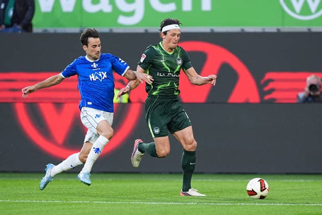September 18, 2026, xydrx, Men s, Soccer, 2. Bundesliga, VfL Wolfsburg vs. SV Darmstadt 98, 2026–2027 season, Volkswagen Arena, Christopher Lannert (SV Darmstadt 98), No. 28 in a tackle against Fabian Reese (VfL Wolfsburg), No. 11. DFB regulations prohibit any use of photographs as image sequences and or quasi-video. Copyright: HMBxMedia YannisxDreimann