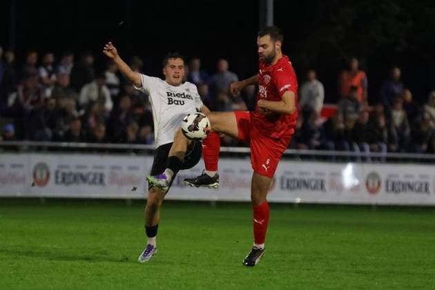 September 18, 2026, Soccer, Men s, 2026–2027 season, Bavarian Regional League, Matchday 10: TSV Buchbach vs. FC Schweinfurt 05. From left: Nils Piwernetz (FC Schweinfurt 05, 19) vs. Philipp Walter (TSV Buchbach, 06). Buchbach SMR Arena, Bavaria, Germany
