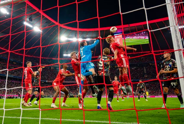 September 18, 2026, 2026–2027 Bundesliga Season, Matchday 4, FC Bayern Munich vs. 1. FC Union Berlin, at the Allianz Arena in Munich, tackle, from left: Michael Aebischer (Union Berlin), Minjae Kim (Bayern Munich), Minjae Kim, goalkeeper Frederik Rönnow (Union Berlin), Harry Kane (FC Bayern Munich), Leopold Querfeld (Union Berlin)