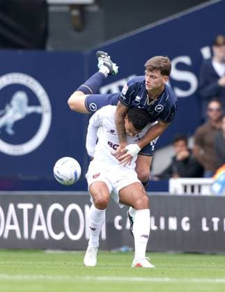 Jenson Metcalfe (M) Divine Mukasa (WHU) at the Millwall v West Ham EFL Championship match at The New Den. Millwall v West Ham United, EFL Sky Bet Championship, Football, The Den, London, UK - 19 Sep 2026London The Den United Kingdom EDITORIAL USE ONLY No use with unauthorised audio, video, data, fixture lists, club league logos or live services. Online in-match use limited to 120 images, no video emulation. No use in betting, games or single club league player publications. Paul M Copyright: xPaulxMarriott Shutterstockx 17158320ab