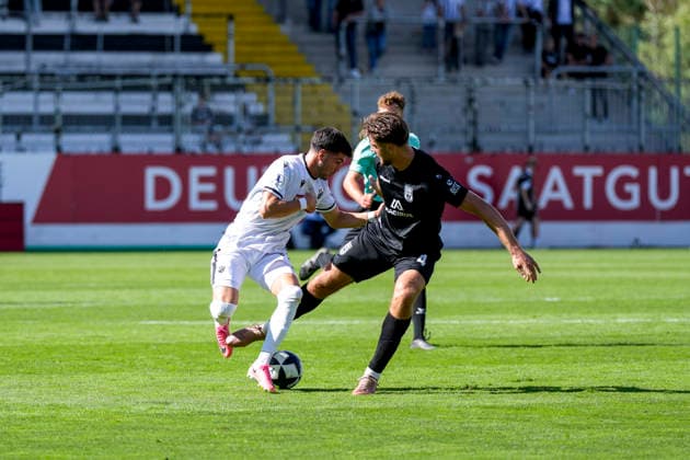 From left: Mert Tasdelen (SVS), 11, Daniel Hülsenbusch (Ulm), 4, tackle, game play, duel, tackle, tackling, dynamism, action, 19 09 2026, Sandhausen, Germany, soccer, Regionalliga Southwest, SV Sandhausen vs. SSV Ulm 1846 xozx