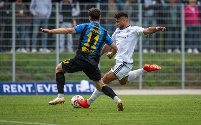 Soccer, 2026–2027 Season, Regionalliga West, September 19, 2026, Matchday 9, Men’s, 1 FC Bocholt (white) vs. SC Wiedenbrück (black), from left: Maik Amedick (SC Wiedenbrück), Malek Fakhro (1 FC Bocholt), Bocholt Stadion am Huenting, Germany 260919_fb_1fc-bocholt_sc-wiedenbrueck_58993