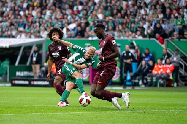 September 19, 2026, GER, Soccer, Men s, 1. Bundesliga, 2026–2027 Season, Matchday 4, SV Werder Bremen vs. FC Augsburg; Marco Grüll (Werder Bremen), 17, in a tackle with Han Noah Massengo (FC Augsburg), 04, Chrislain Matsima of FC Augsburg, 05. DFB and DFL regulations prohibit any use of photographs as image sequences and or quasi-video. Weserstadion, Bremen, Germany Copyright: xNordphoto Memmlerx