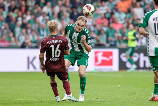 From left: Hennes Behrens of FC Augsburg, 16, and Amos Pieper of SV Werder Bremen, 5, in a one-on-one battle, duel, dynamic moment, action, game scene, during a header, action, game scene, DFL REGULATIONS PROHIBIT ANY USE OF PHOTOGRAPHS AS SEQUENCE IMAGES AND OR VIDEO-LIKE PHOTO SERIES DFL REGULATIONS PROHIBIT ANY USE OF PHOTOGRAPHS AS IMAGE SEQUENCES AND OR QUASI-VIDEO, September 19, 2026, Bremen, Germany, Soccer, Bundesliga, SV Werder Bremen vs. FC Augsburg xobx