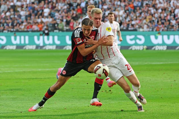 Younes Ebnoutalib, Eintracht Frankfurt, No. 11, in a tackle with Matthias Ginter, SC Freiburg, 28, Eintracht Frankfurt vs. SC Freiburg, Bundesliga, BL, 2026–2027 season, Match 4, September 19, 2026, Frankfurt, Deutsche Bank Park, Germany